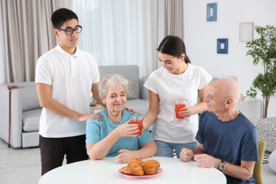 senior people with young caregivers