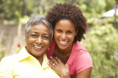 senior woman and adult woman are smiling