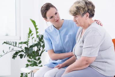 caregiver talking to senior woman